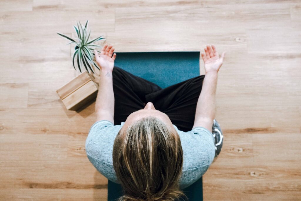 a person practicing a healthy habit of meditation